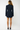 Sustainable dark-wash denim mini dress with long sleeves, cinched waist and structured shoulders.