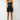 pleated denim skort with front zip and tailored cut